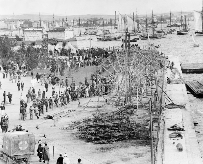 Framework of the Zeppelin LZ.85 being set up on the sea front beside the White Tower in Salonika, May 1916. ©IWM Q32030”